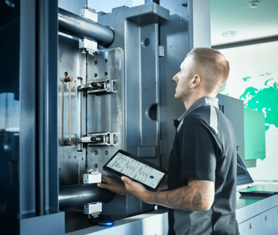 Comtec technician completing advanced training at Arburg, Germany